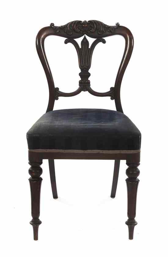 Appraisal: A Victorian Rosewood Side Chair with a carved foliate crest