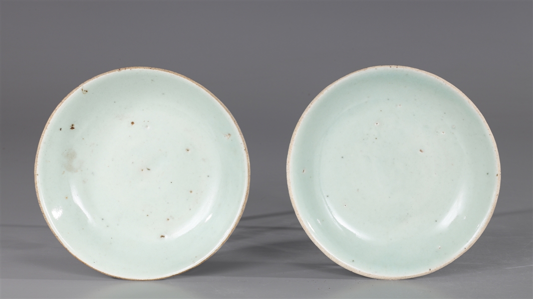 Appraisal: Pair of antique Chinese celadon glazed porcelain dishes each with