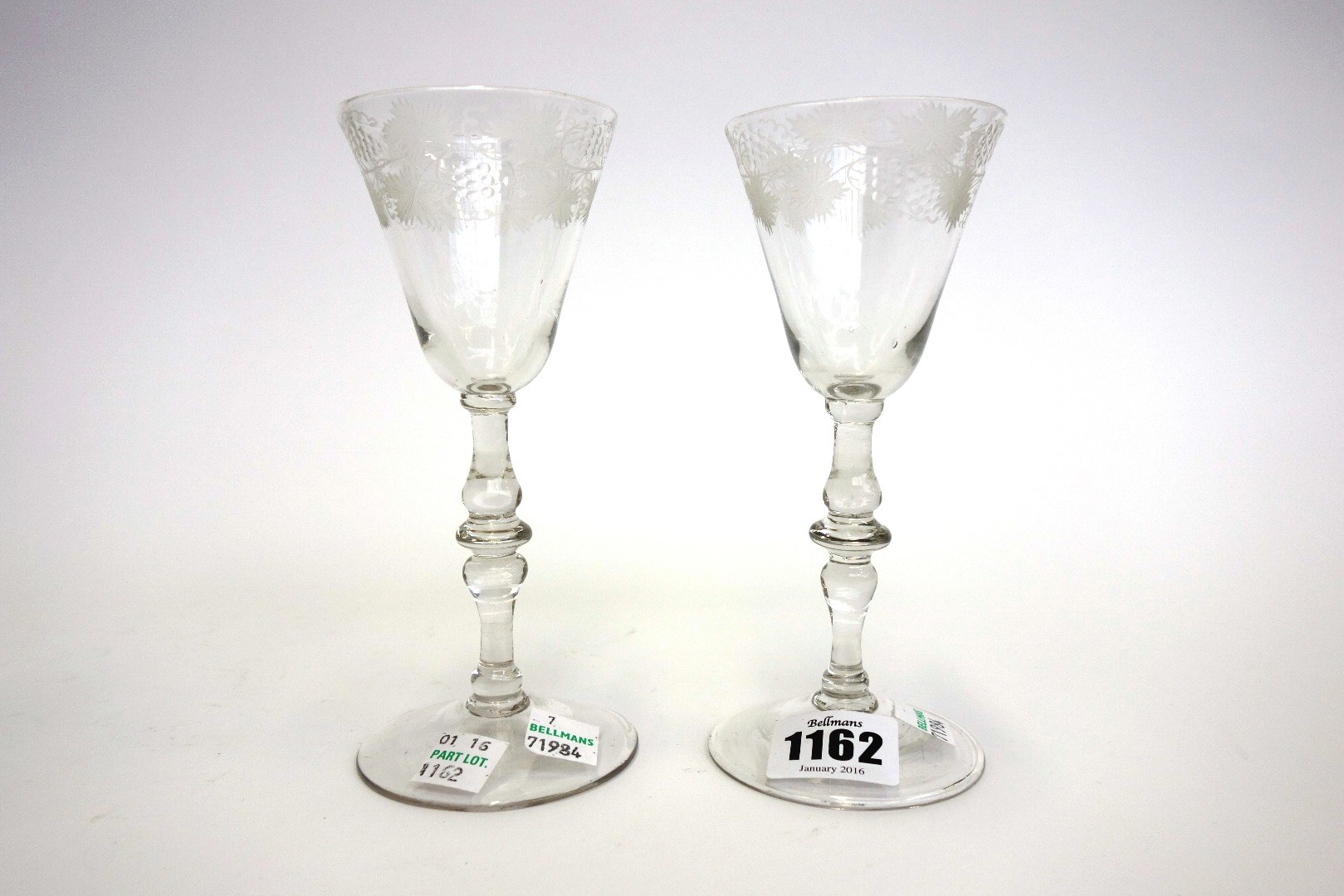 Appraisal: A pair of English engraved wine glasses circa each with