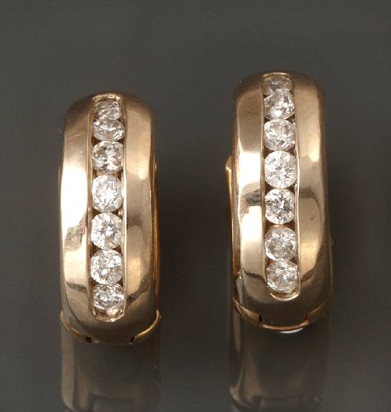 Appraisal: A pair of diamond and two-tone gold hoop earrings