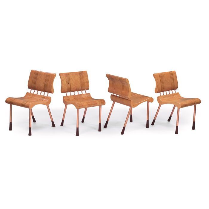 Appraisal: s plywood chairs four solid sculptural seats and backrests formed