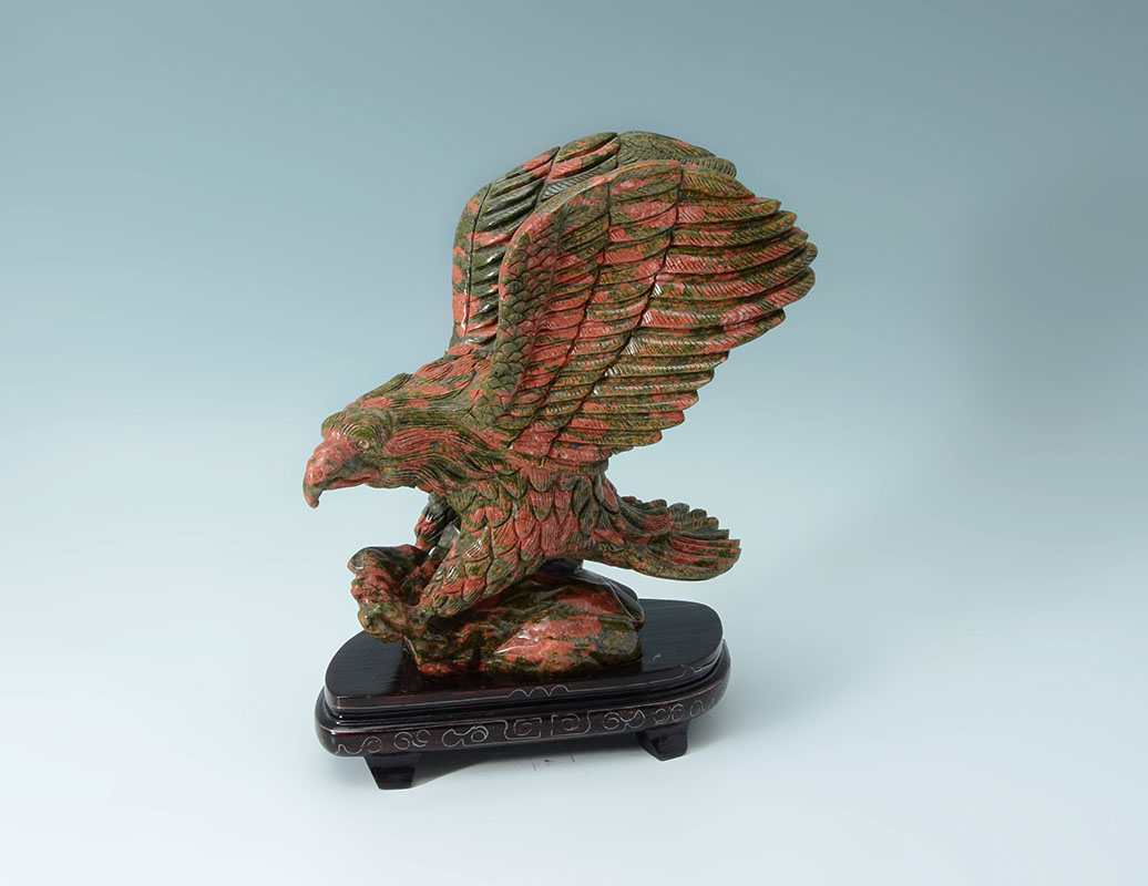 Appraisal: CARVED JASPER FIGURAL EAGLE Chinese carved red and pink jasper