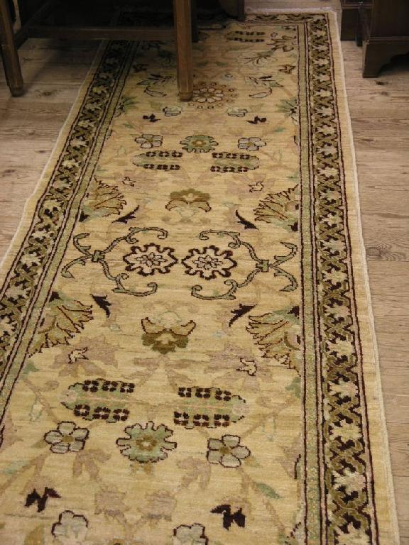 Appraisal: A modern Persian runner coloured in claret green and beige