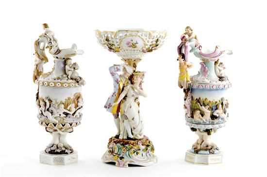 Appraisal: German porcelain centerpiece and ewers early th century reticulated centerpieces