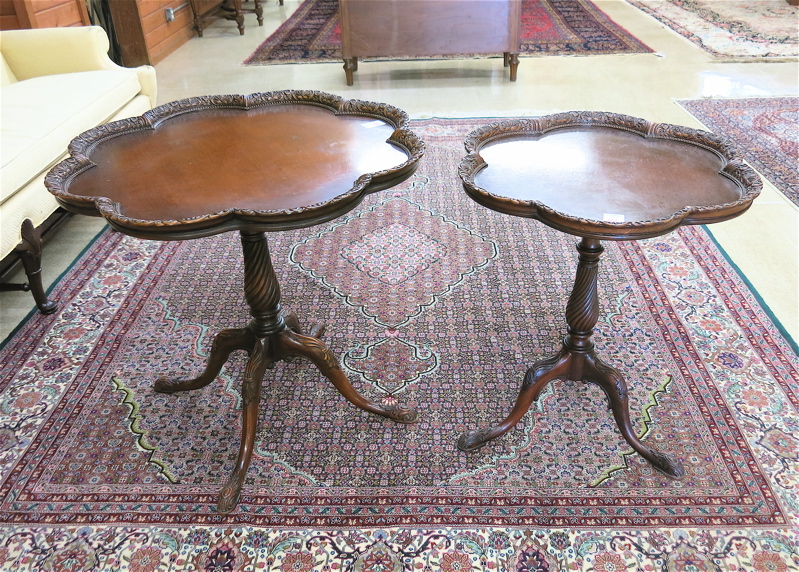 Appraisal: TWO MATCHING CHIPPENDALE STYLE MAHOGANY LAMP TABLES American mid- th