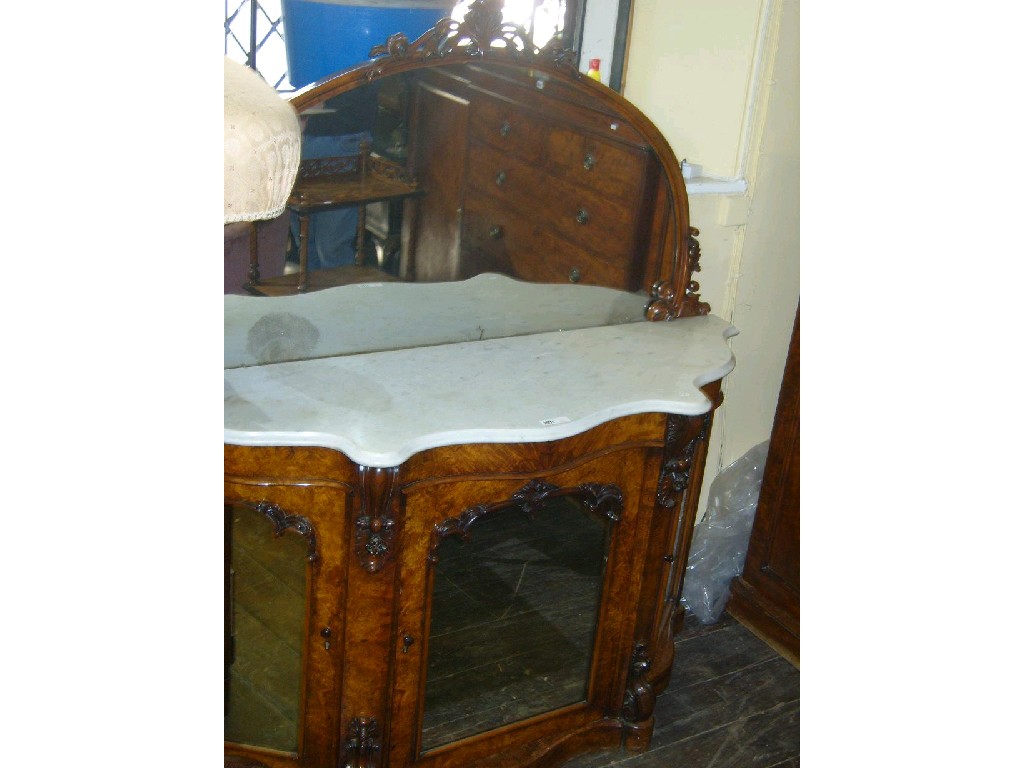 Appraisal: A Victorian walnut and figured walnut chiffonier with serpentine outline