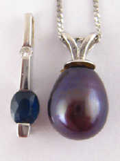 Appraisal: A grey cultured pearl pendant on a white metal tests