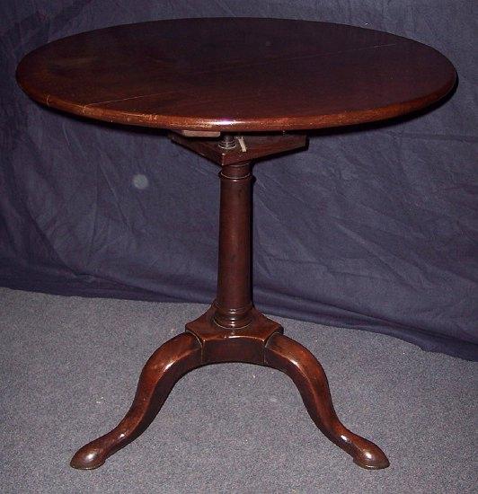 Appraisal: A George II mahogany table the circular top above a