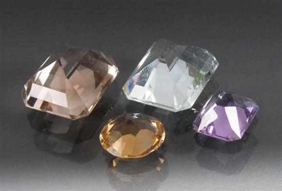 Appraisal: Assorted gemstones pale blue gemstone possibly aquamarine pale purple gemstone