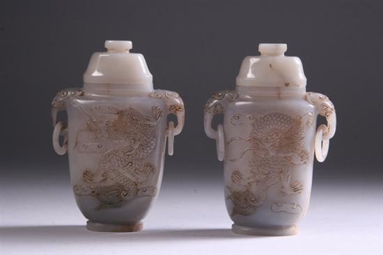 Appraisal: TWO CHINESE GREY AND RUSSET JADE VASES With carved dragon