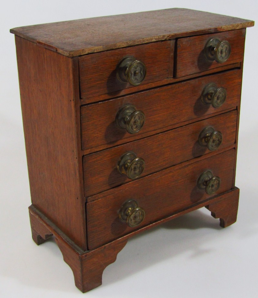 Appraisal: An early thC oak miniature chest of two short and