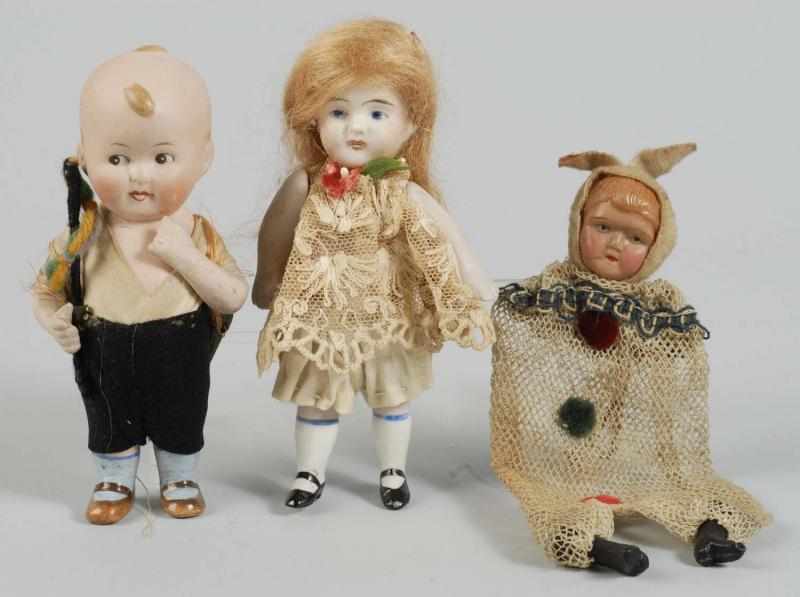 Appraisal: Lot of Small Dolls Description German bisque character boy with