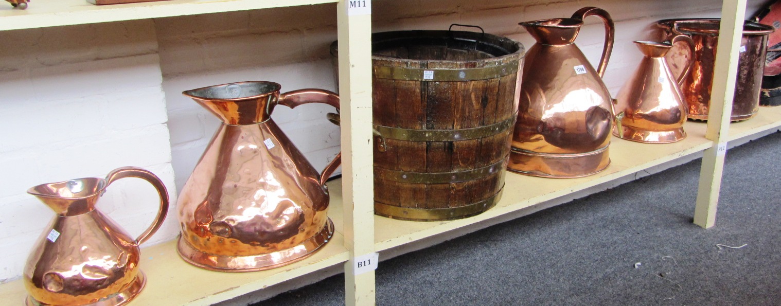 Appraisal: A part set of four copper graduated jugs late th