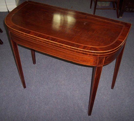 Appraisal: A th Century mahogany fold-over card table of D-shape with