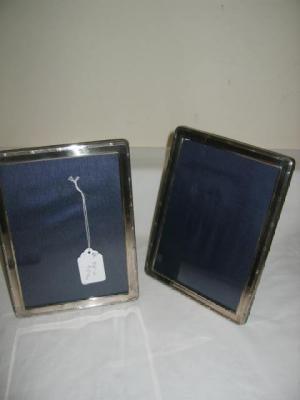 Appraisal: A MATCHED PAIR OF PHOTO FRAMES of oblong form with