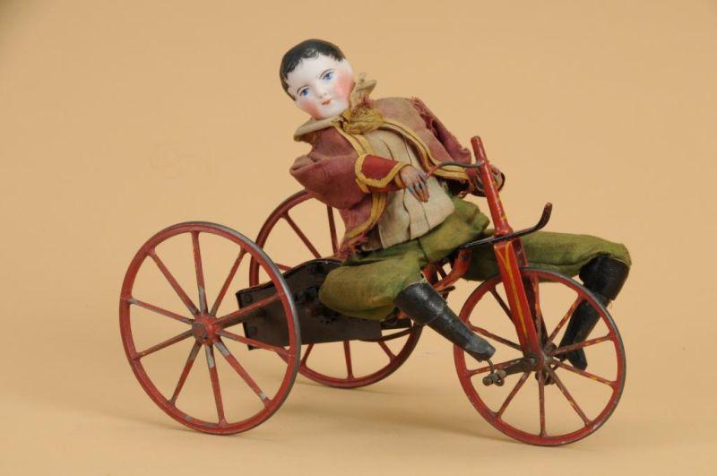 Appraisal: Early Mechanical Boy on Velocipede France ca unmarked French bisque