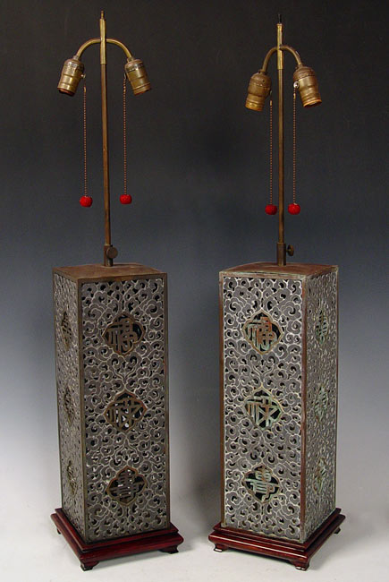 Appraisal: PAIR CHINESE PIERCED METAL LAMPS Pierced metal body with wood