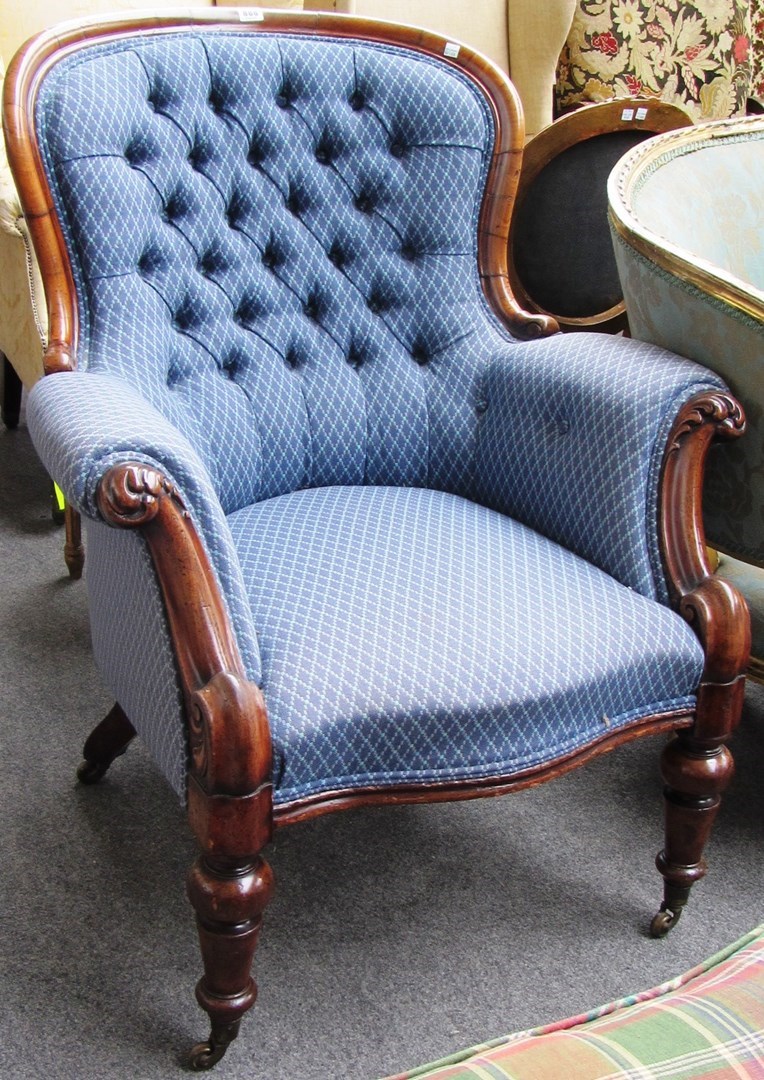 Appraisal: A Victorian mahogany framed spoonback armchair with serpentine seat on