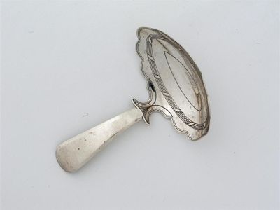 Appraisal: A George III caddy spoon with a scalloped edged bowl