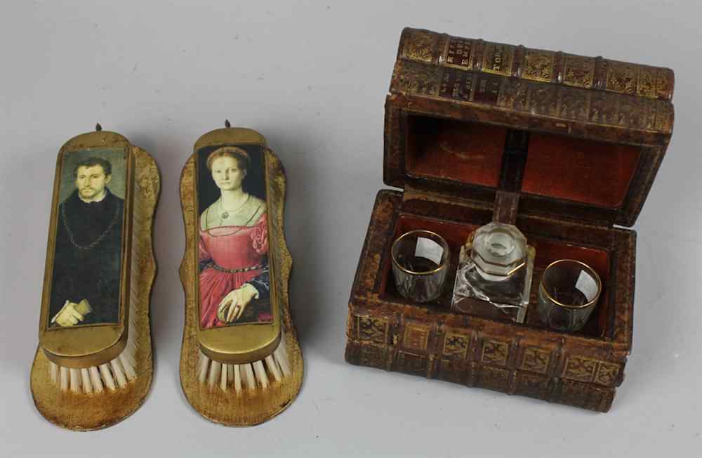 Appraisal: FRENCH BOOK FORM TANTALUS AND TWO SOUVENIR BRUSHES the first