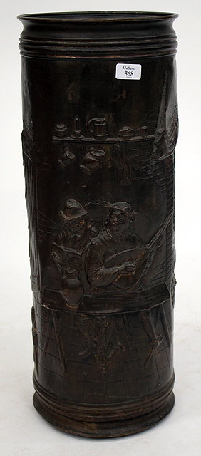 Appraisal: AN ANTIQUE STYLE BRONZED UMBRELLA STAND with embossed tavern scene