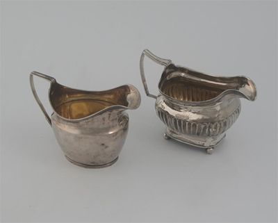 Appraisal: A George III part-fluted cream jug on bell feet by