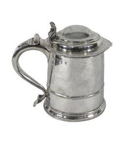 Appraisal: A Queen Anne Britannia standard lidded tankard with scrolling thumbpiece