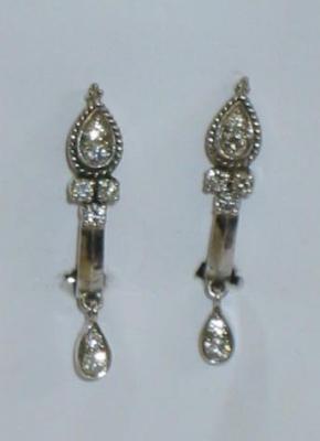 Appraisal: A PAIR OF DIAMOND EARRINGS having a white gold curved