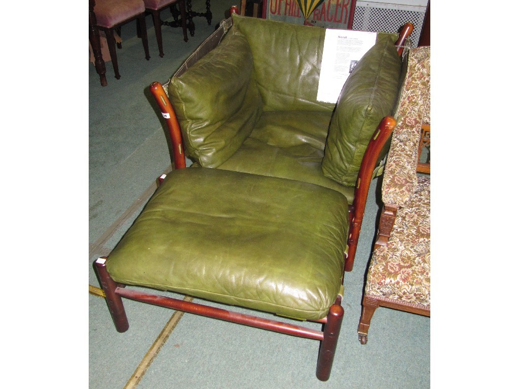 Appraisal: th Century design leather and wood armchair with stool by