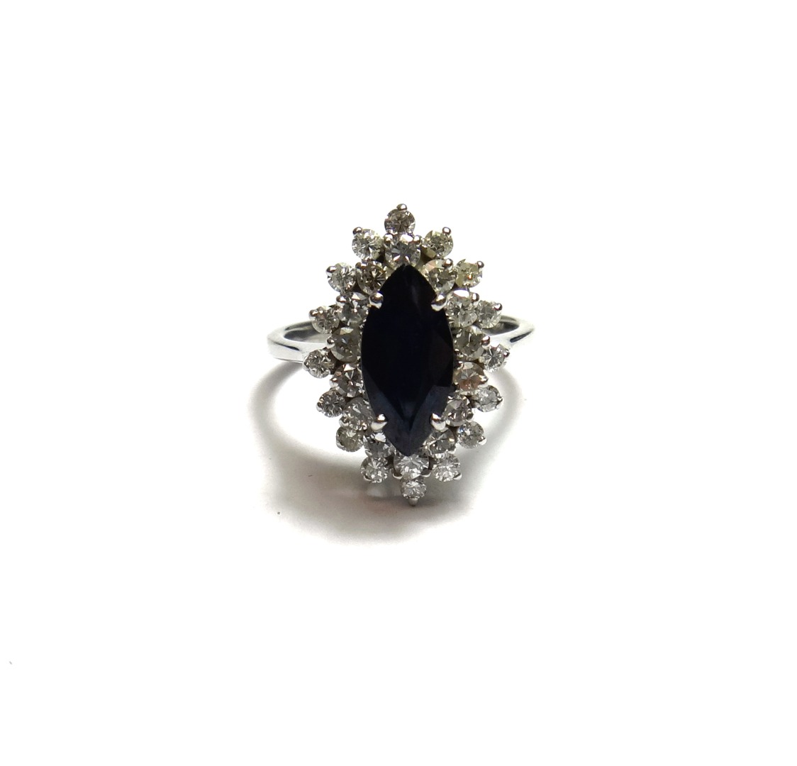 Appraisal: A white gold sapphire and diamond set marquise shaped cluster