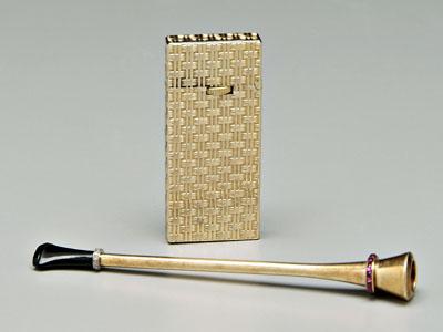 Appraisal: Gold cigarette holder and lighter kt trumpet-form holder single-cut diamonds