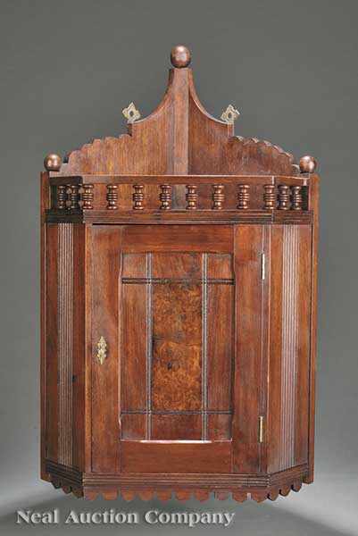 Appraisal: An American Modern Gothic Walnut Hanging Corner Cupboard c spherule