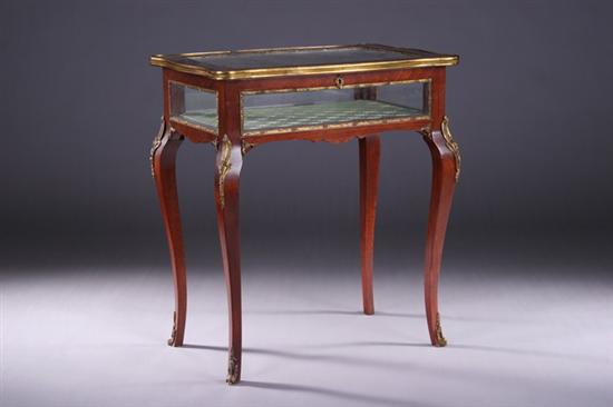 Appraisal: LOUIS XV-STYLE ORMOLU-MOUNTED GREEN SILK-LINED VITRINE TABLE Early th century