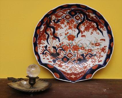 Appraisal: JAPANESE IMARI PORCELAIN DISH Staple repaired Together with a rock