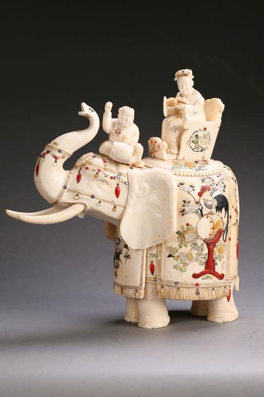 Appraisal: IVORY FIGURAL GROUP Asian th century Elephant with shibayama trappings