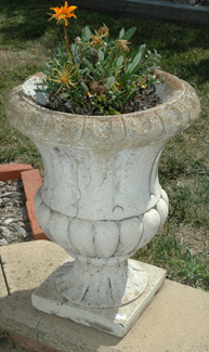 Appraisal: A PAIR OF REGENCY STYLE CONCRETE URNS cm high