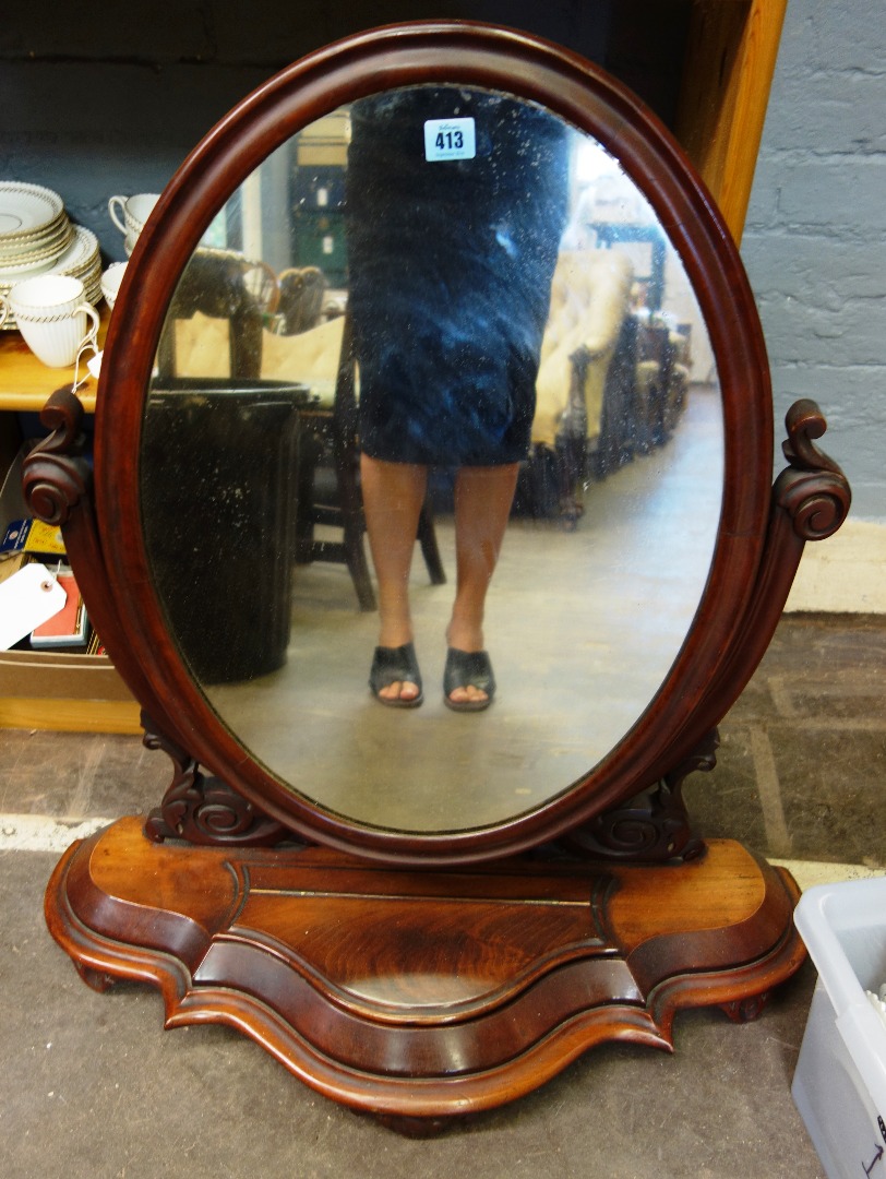 Appraisal: A Victorian mahogany swing toilet mirror the serpentine fronted plateau