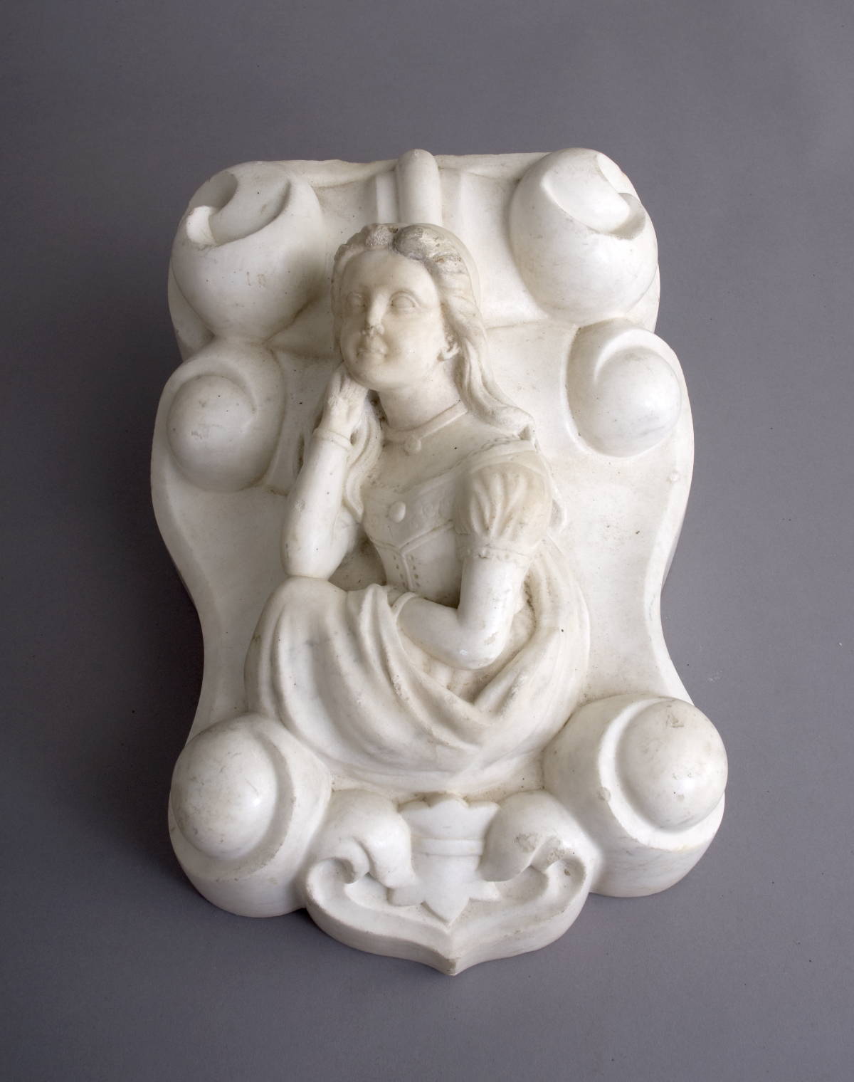 Appraisal: CARVED MARBLE ARCHITECTURAL BRACKET WITH FEMALE FIGURE Height inches width