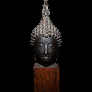 Appraisal: A Large Thai Bronze Head of Buddha with a downcast