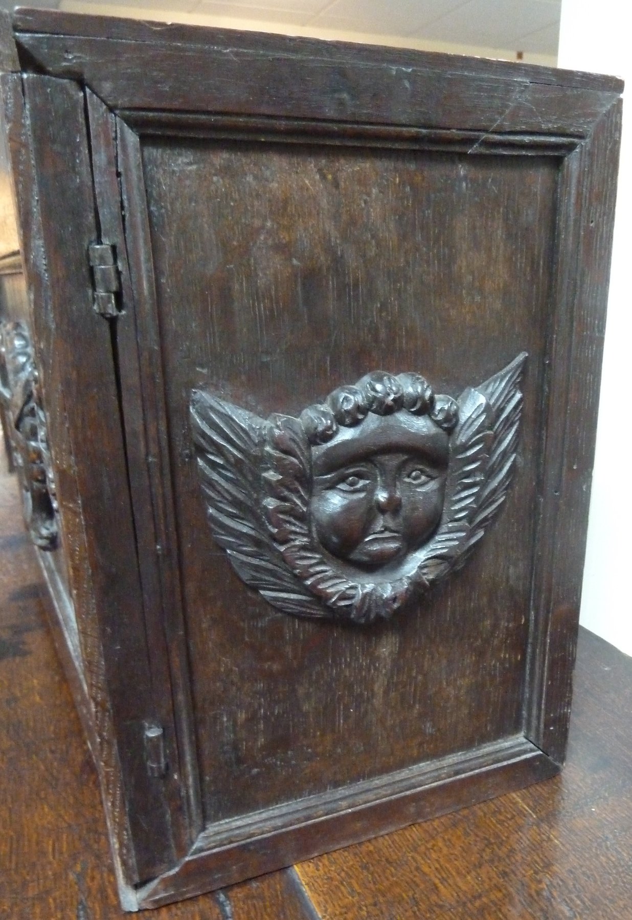 Appraisal: A th Century oak spice box the panelled door centred