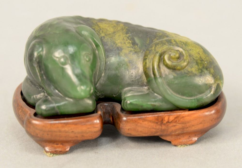 Appraisal: Carved Chinese green jade recumbent dog on carved stand length