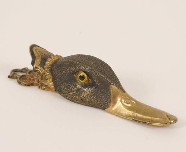 Appraisal: Victorian patinated and gilt duck form hanging clip the head