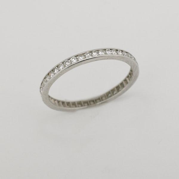 Appraisal: DIAMOND AND PLATINUM ETERNITY BAND Channel-set single cut diamonds approx