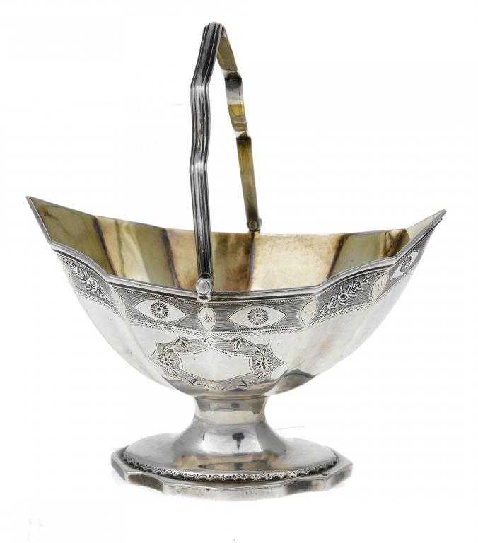 Appraisal: A GEORGE III BRIGHT CUT SUGAR BASKET of fluted navette