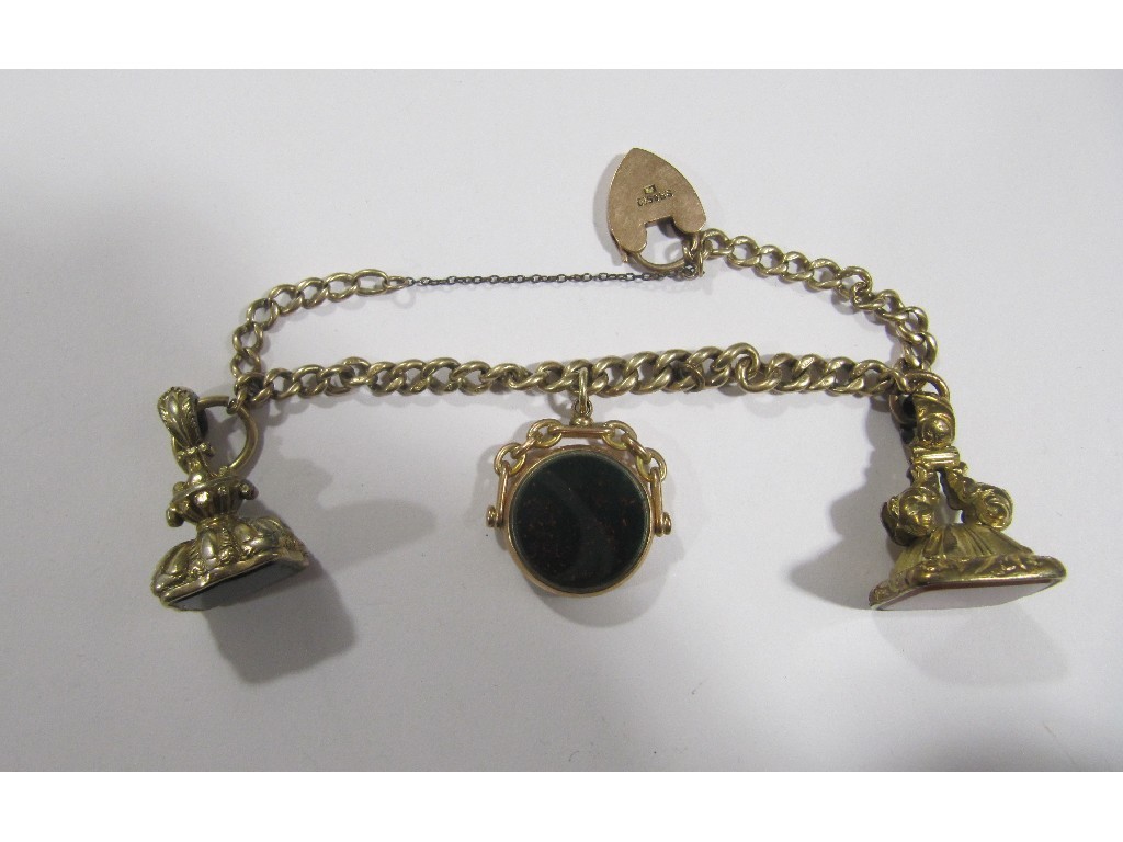 Appraisal: Nine carat gold curb link bracelet with three Victorian stone