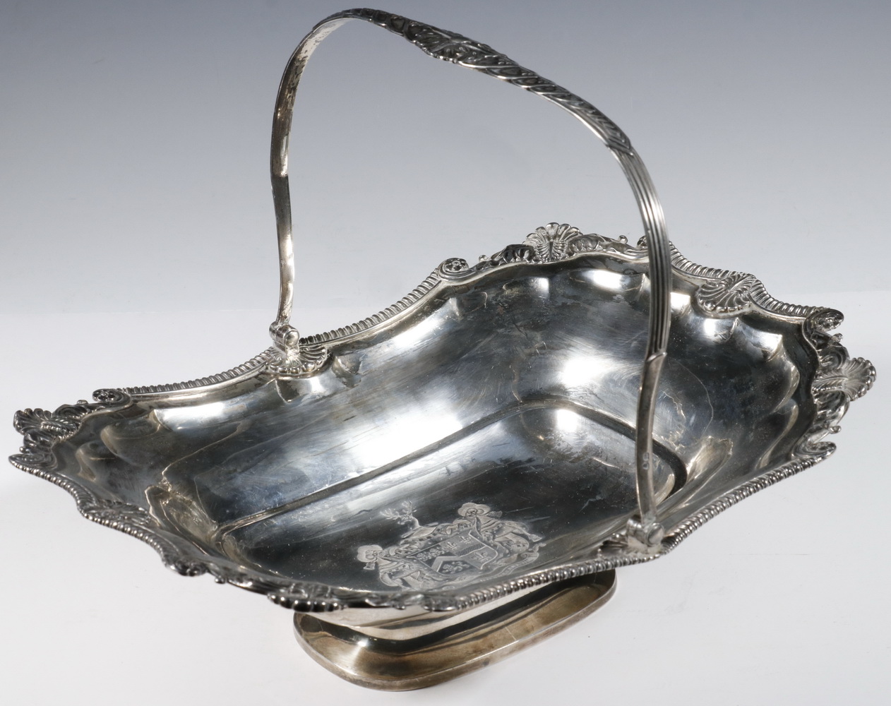 Appraisal: GEORGE III SILVER ARMORIAL CAKE BASKET BY SAMUEL HENNELL English