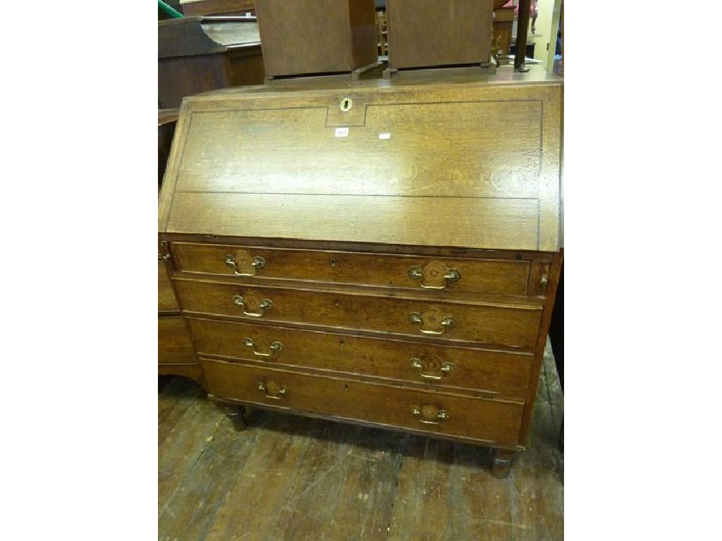 Appraisal: An early th century oak bureau the fall front enclosing