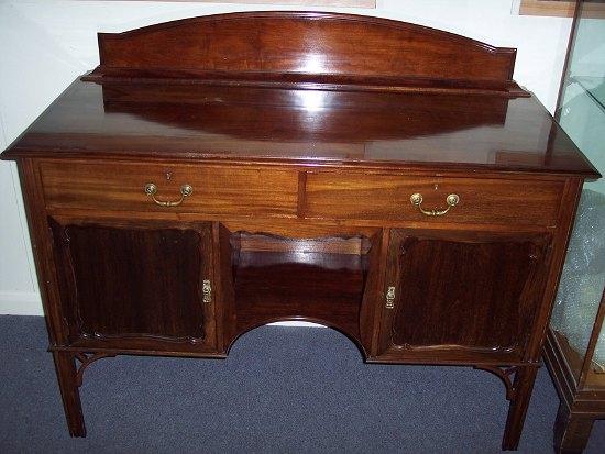 Appraisal: An Edwardian mahogany sideboard fitted two drawers and cupboards with