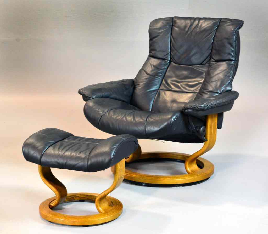 Appraisal: Ekornes Reclining Chair with FootrestBlack leather Danish Modern chair with