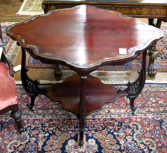 Appraisal: LATE VICTORIAN MAHOGANY LAMP TABLE Louis XV style American late